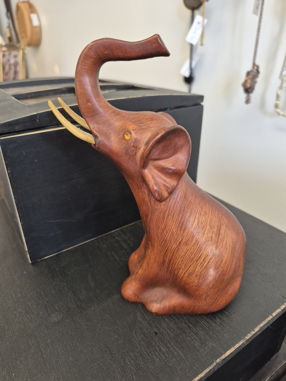 Carved Wooden Elephant Figurine with Raised Trunk - Brown